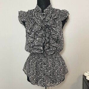 Miley Cyrus black & white zebra print button up blouse with ruffle details